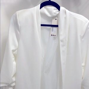 Black and white blazer with tags still on